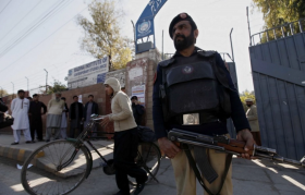 Police stand guard outside a school in Peshawar, Pakistan, a day after a Taliban attack at Bacha Khan University killed 21 people. Security of educational institutions across the country has been intensified as militants appear to be targeting schools with more intensity. (EPA/ARSHAD ARBAB)