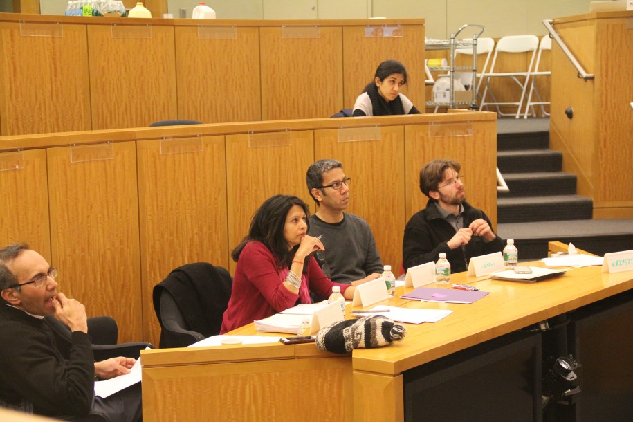 The interdisciplinary judging panel listens to student pitches.