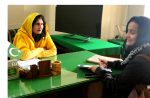 Farwa, right, interviewing a government official on the status of state run special education institutes in Pakistan