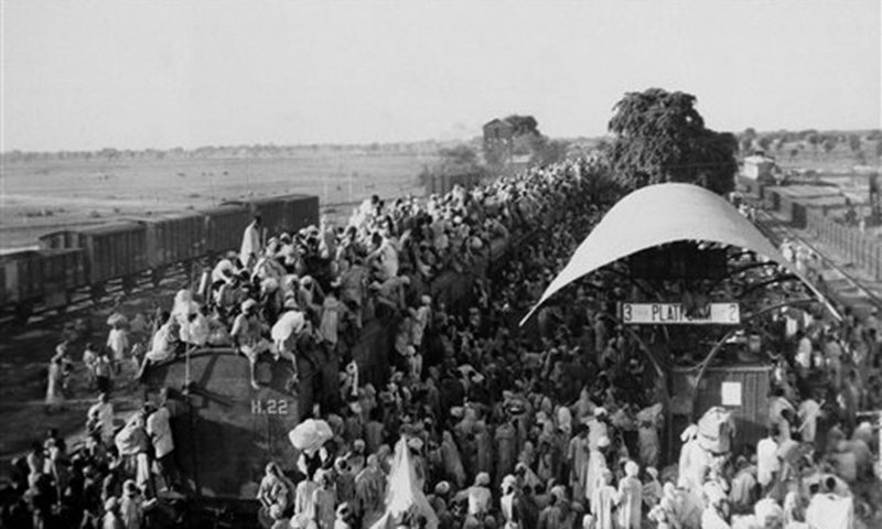 FILE - In this Sept. 19, 1947 file photo, Muslim refugees sit on the roof of an overcrowded coach railway train near New Delhi in trying to flee India. Millions of Muslims migrated from India to Pakistan. Partition marked a massive upheaval across the subcontinent. Hindus living for generations in what was to become Pakistan had to flee their homes overnight. (AP Photo, File)