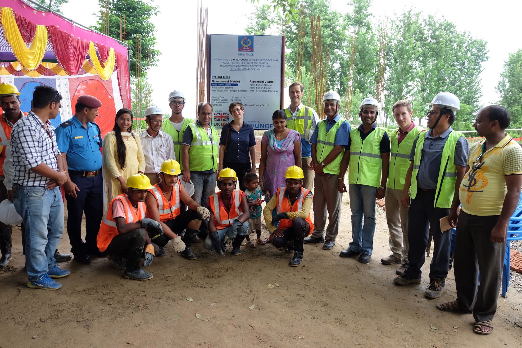 Photos from a field visit in Navilprasi District. People in the photo include community members, contractors, project engineers, project managers, the donor, and me (red shirt third from right).
