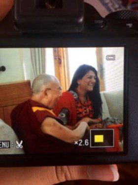 Shaiba pictured with the Dalai Lama as they discuss the current state of religious tolerance in India.