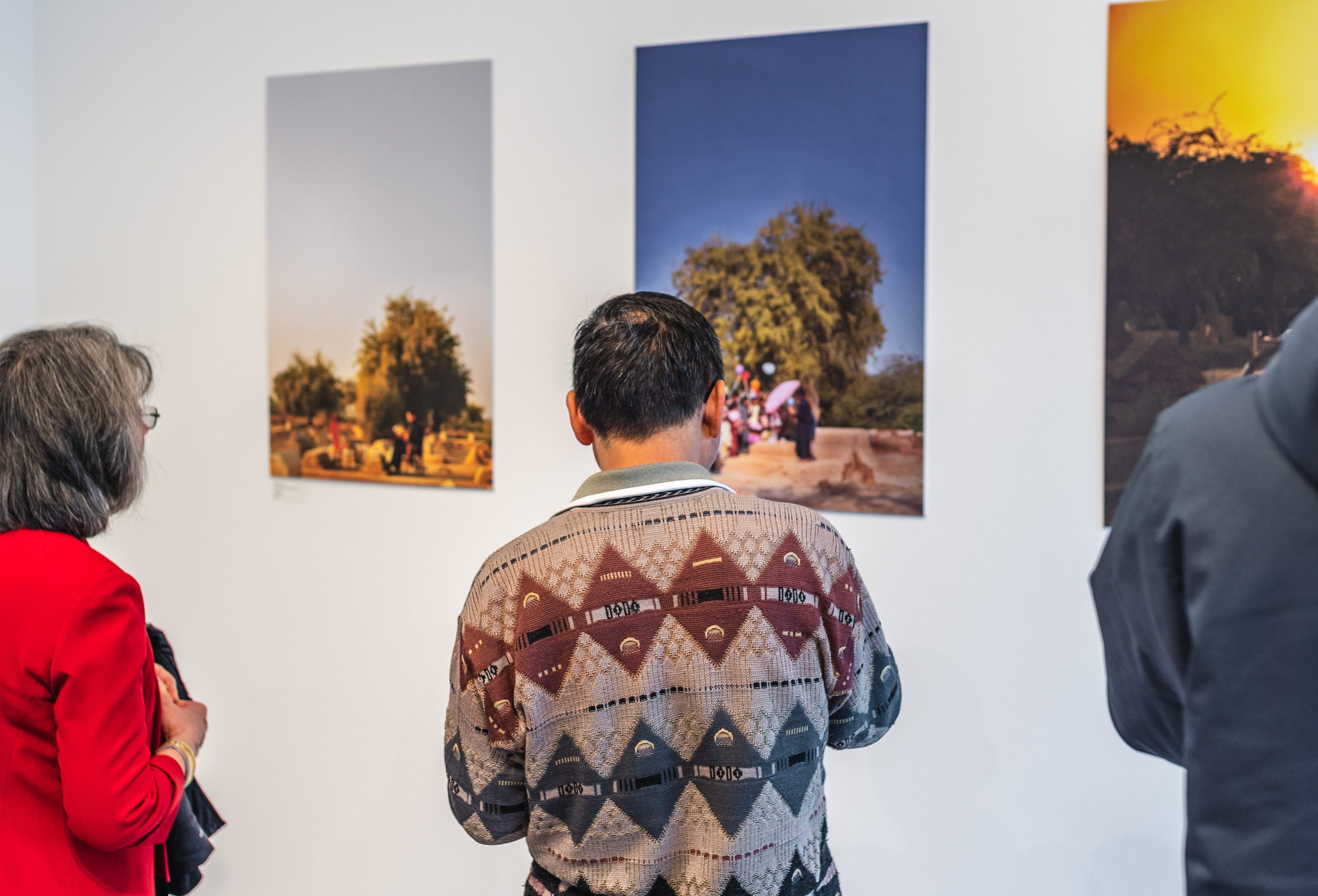 Guests observe the Mittal Institute’s Spring 2019 Visiting Artist Fellows’ work at a gallery exhibition.