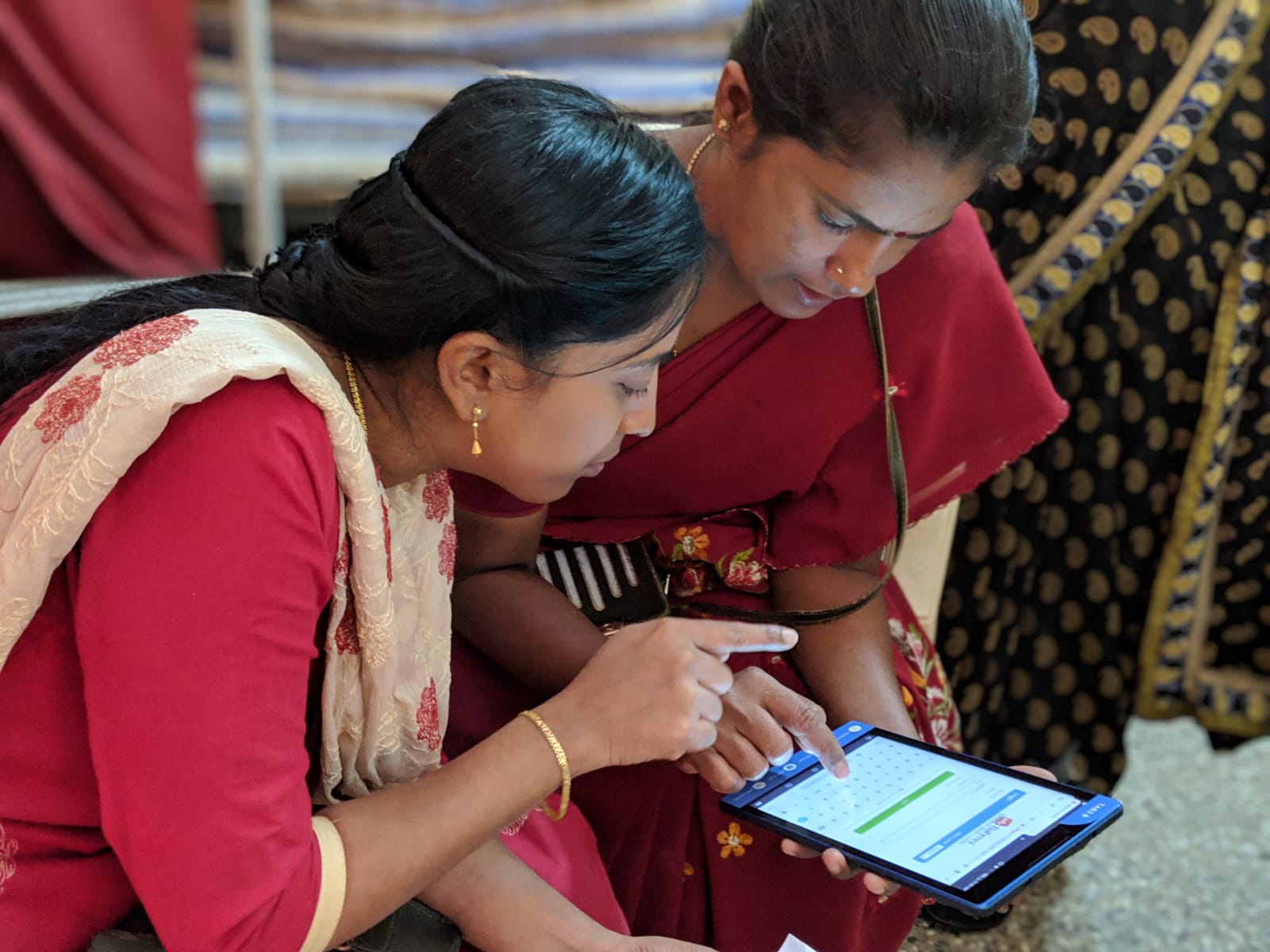 Medical practitioners using tablets and a digital healthcare system.