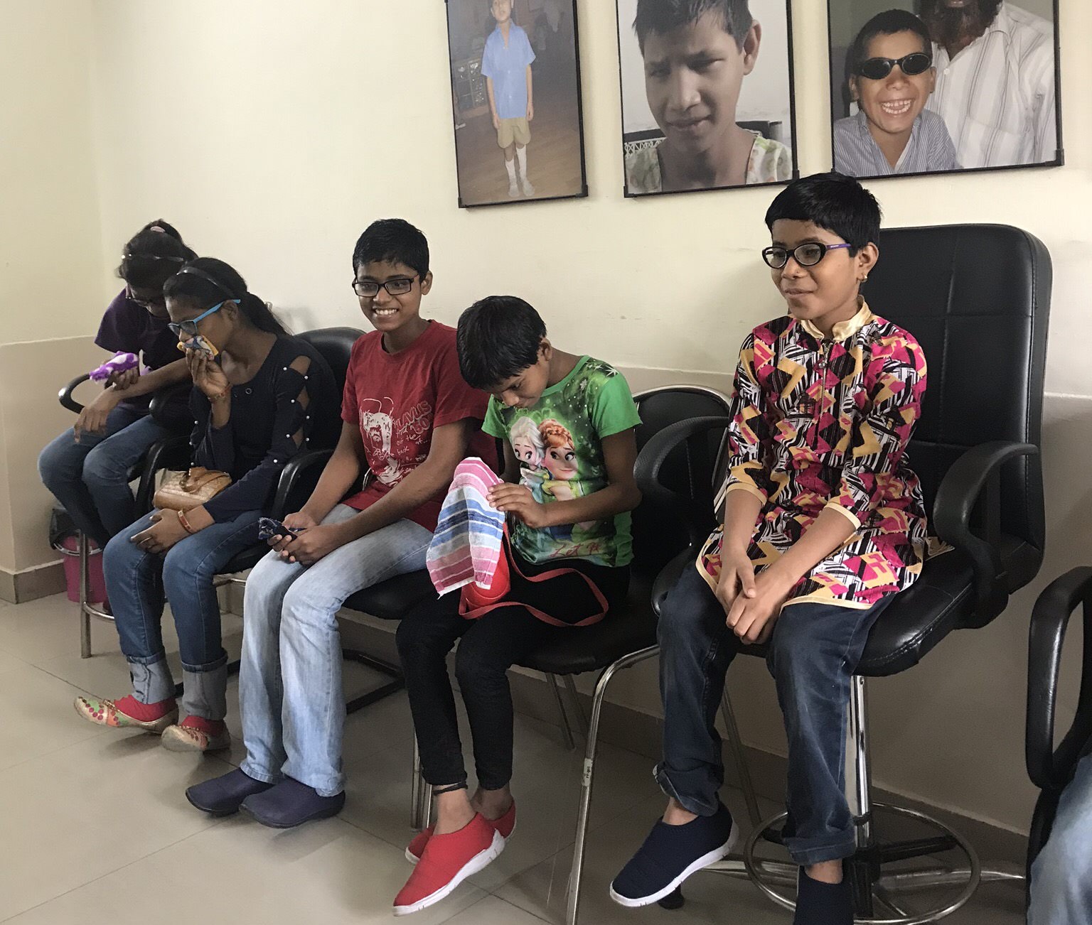 Children wait to be seen by Project Prakash’s doctors at Shroff Charity Eye Hospital.