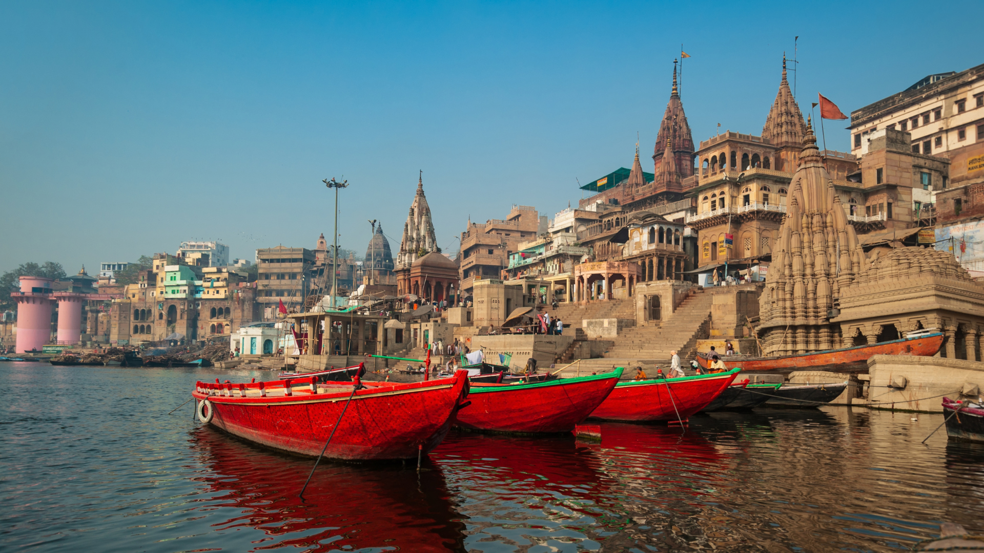 Boat with Flag in Ganga River at Banaras, India. Getty Images.